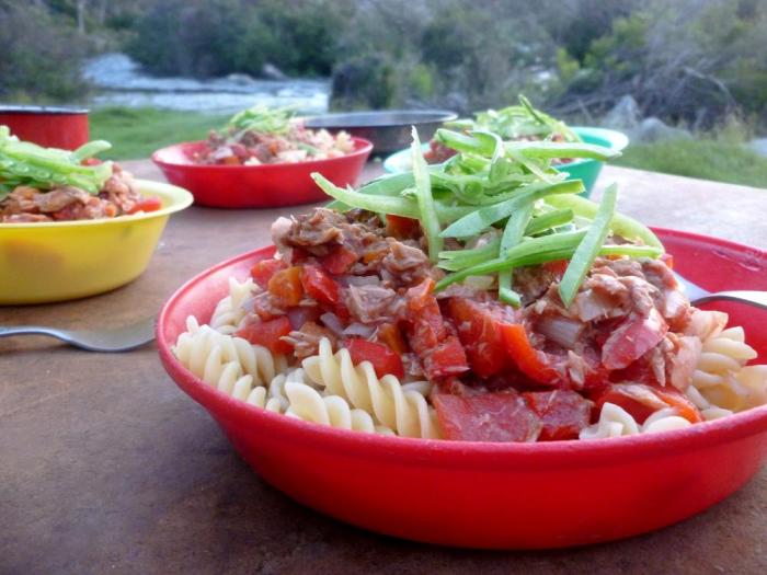Tuna, tomato and basil pasta, served in special plastic camping plates and garnished with some finely sliced snow peas for those important greens